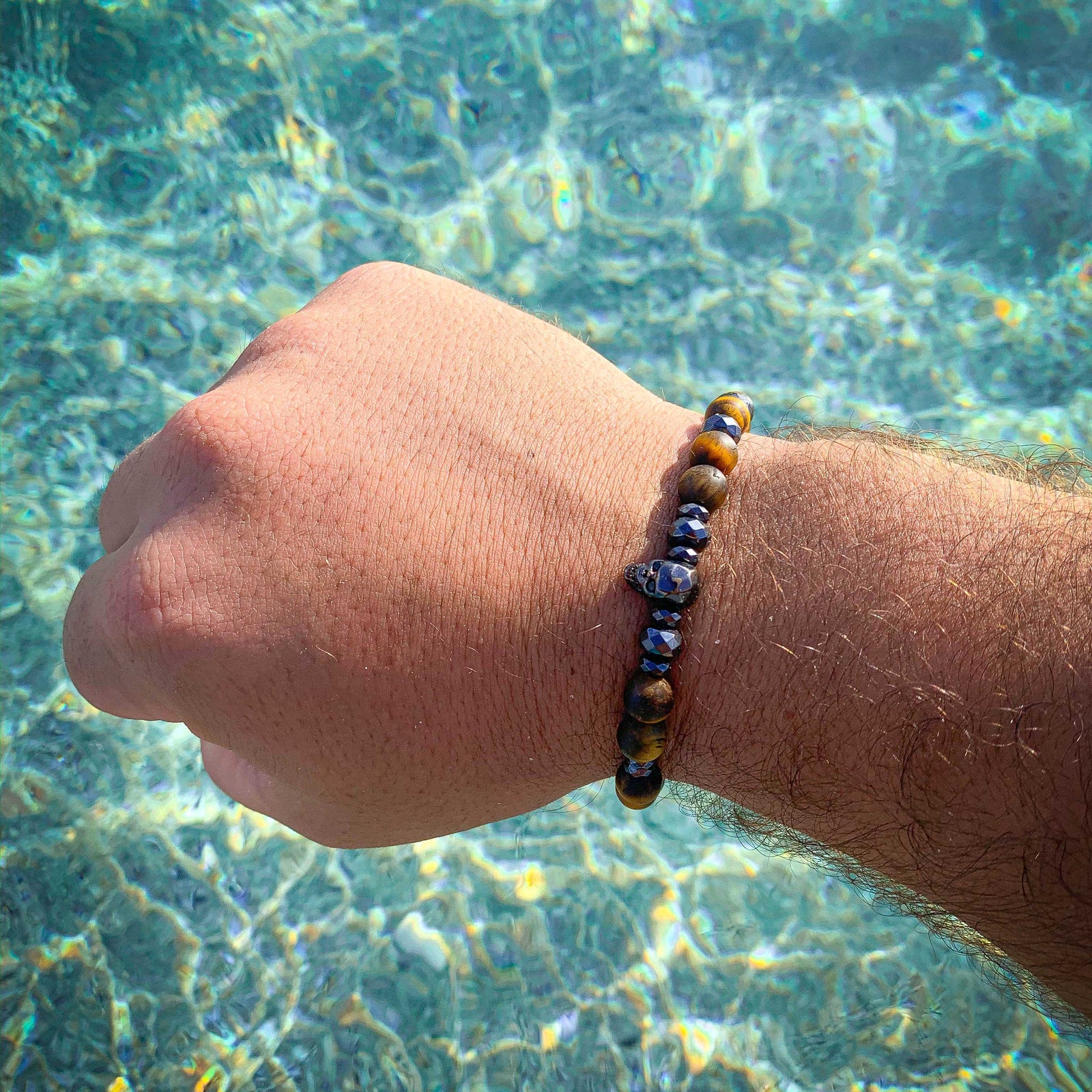 Lagao // Matte Tiger Eye Faceted Hematite Skull